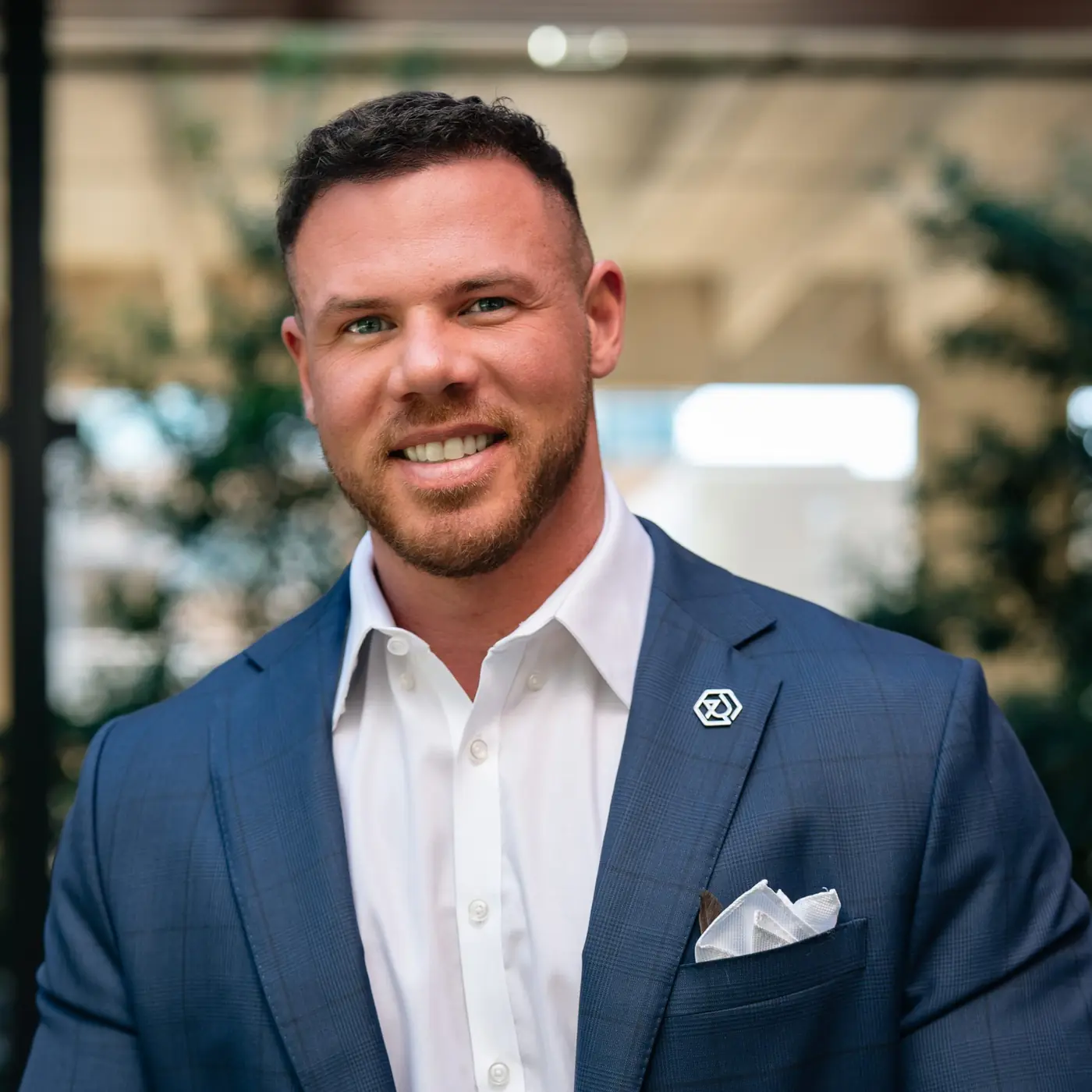 Jake Claver, portrait in a blue check suit